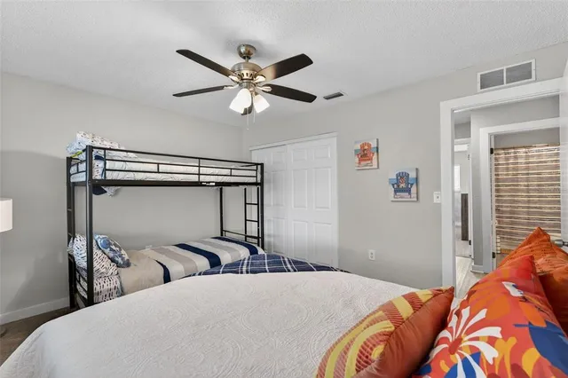 a bathroom with a sink a toilet a shower curtain and a mirror