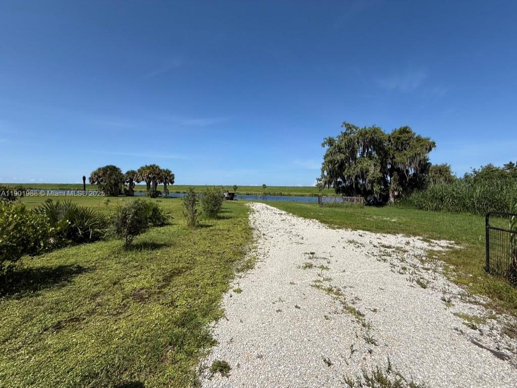 12600 Southwest Conners Highway Okeechobee, FL 34974 - Photo 19 of 60 a view of a beach with a yard