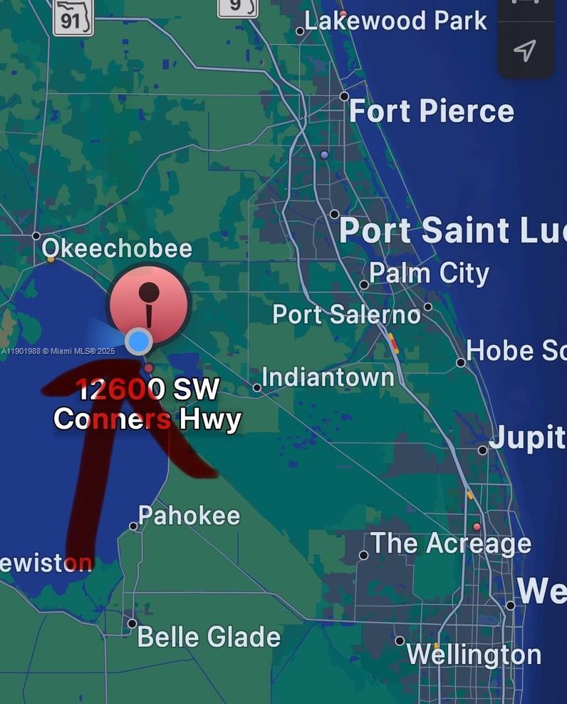 12600 Southwest Conners Highway Okeechobee, FL 34974 - Photo 2 of 60 a sign on the street of a building