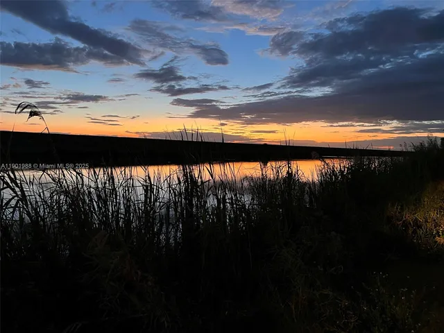 a view of a lake with a yard