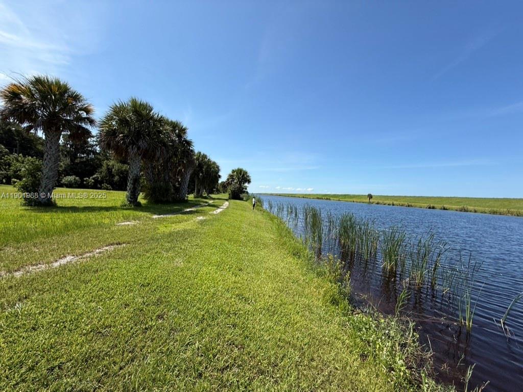 12600 Southwest Conners Highway Okeechobee, FL 34974 - Photo 9 of 60 a view of a lake with a yard