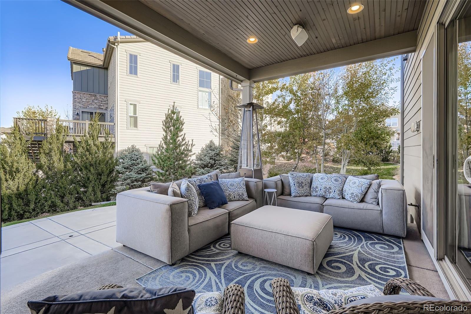 10414 Maplebrook Way Highlands Ranch, CO 80126 - Photo 11 of 45 a living room with furniture and a large window