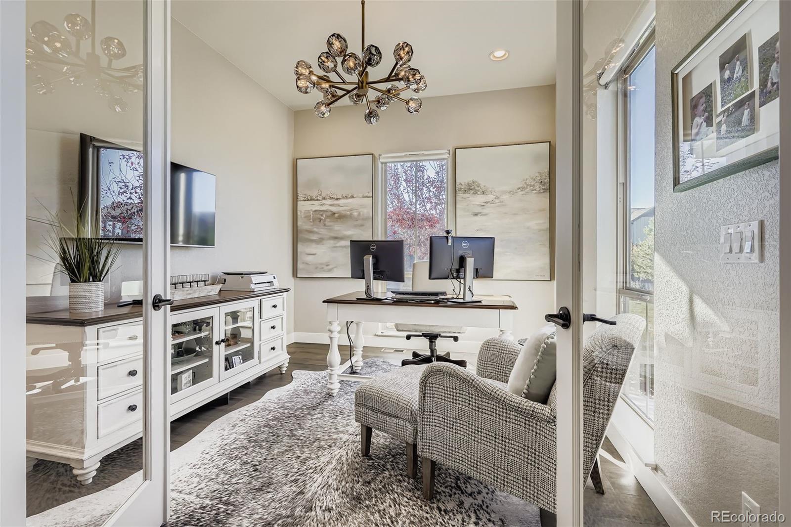 10414 Maplebrook Way Highlands Ranch, CO 80126 - Photo 12 of 45 a living room with furniture kitchen view and a window