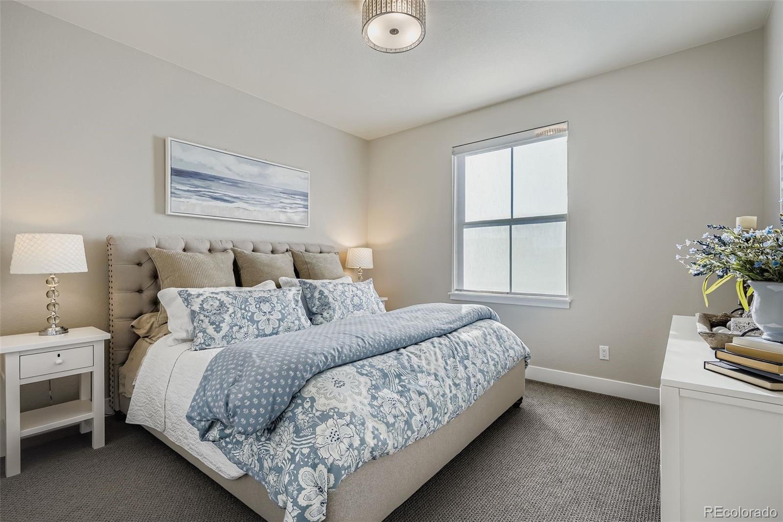 10414 Maplebrook Way Highlands Ranch, CO 80126 - Photo 21 of 45 a bedroom with bed and window