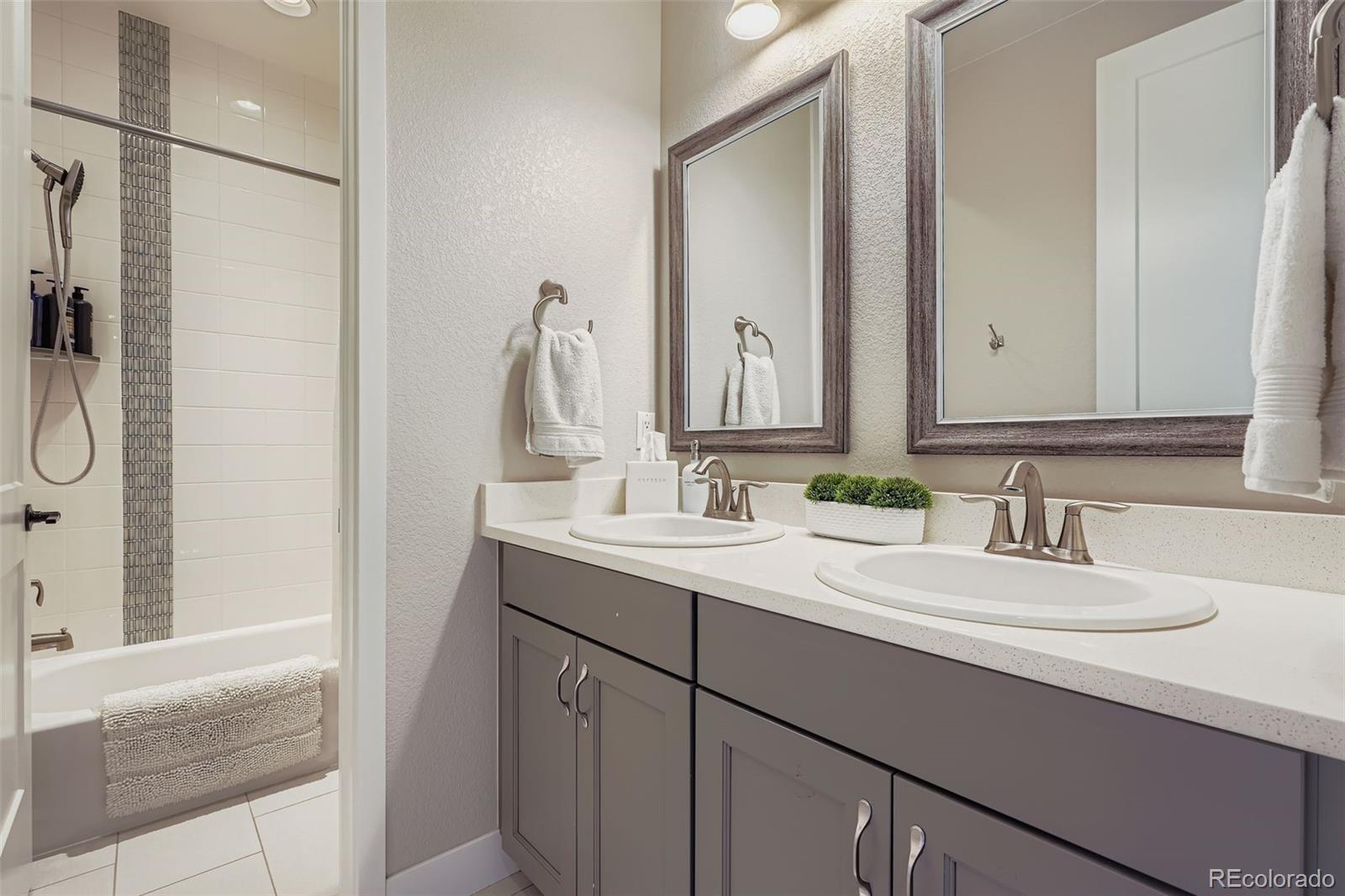 10414 Maplebrook Way Highlands Ranch, CO 80126 - Photo 23 of 45 a bathroom with a sink and a mirror