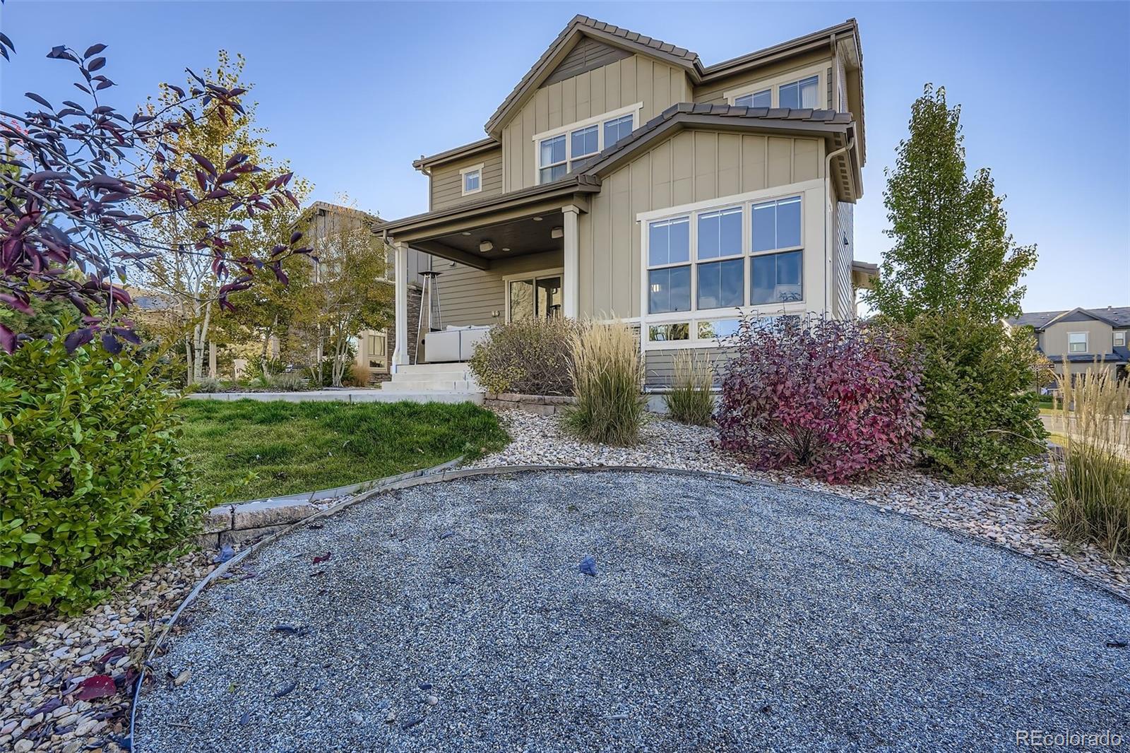 10414 Maplebrook Way Highlands Ranch, CO 80126 - Photo 33 of 45 a front view of a house with garden
