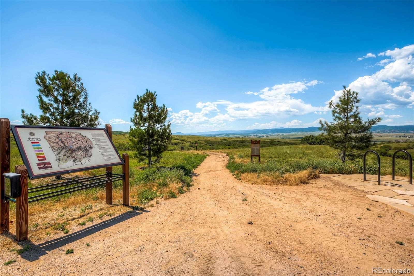 10414 Maplebrook Way Highlands Ranch, CO 80126 - Photo 37 of 45 a view of a lake with outside space
