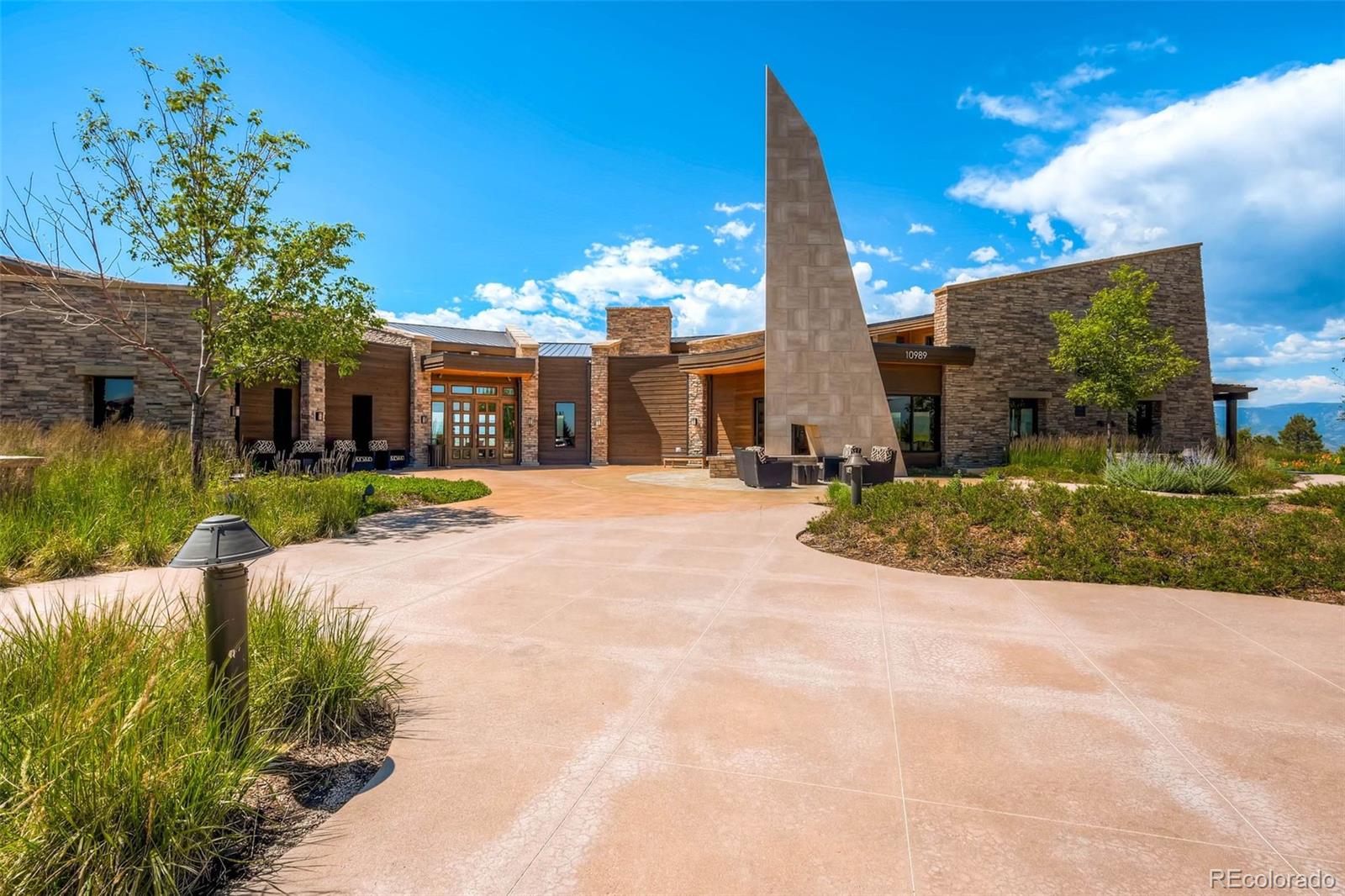10414 Maplebrook Way Highlands Ranch, CO 80126 - Photo 38 of 45 a view of a house with palm trees