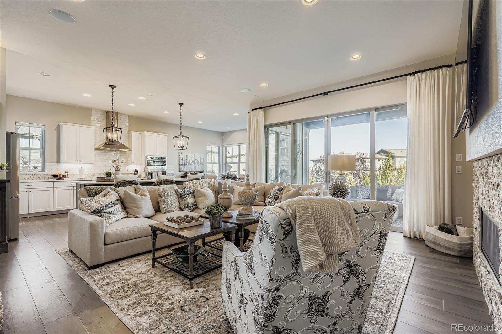 10414 Maplebrook Way Highlands Ranch, CO 80126 - Photo 7 of 45 a living room with furniture and a large window