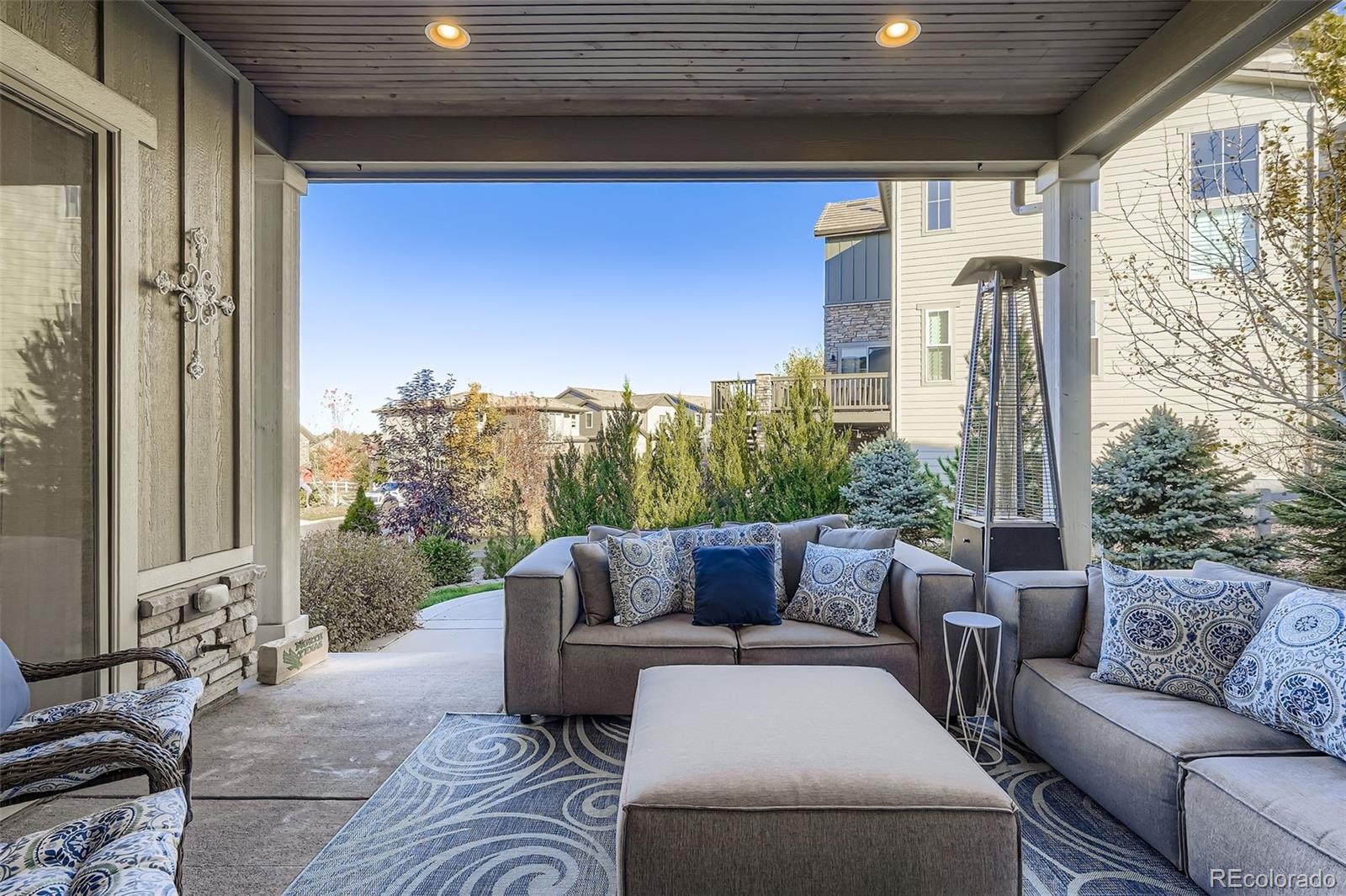 10414 Maplebrook Way Highlands Ranch, CO 80126 - Photo 10 of 45 a outdoor living space with furniture and garden view