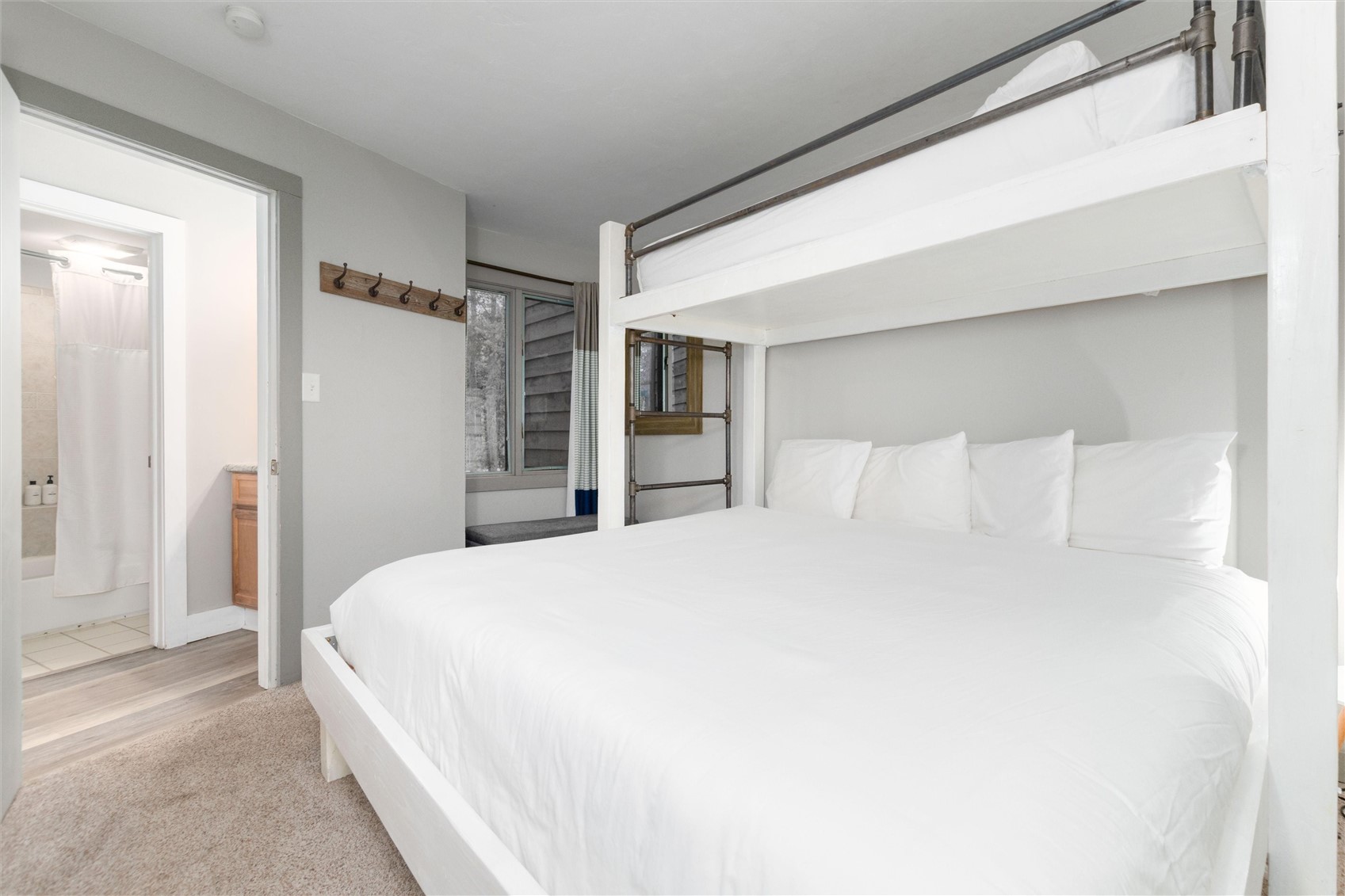 1140 Ski Hill Road, Unit 27 Breckenridge, CO 80424 - Photo 13 of 26 a bedroom with a large bed and a closet