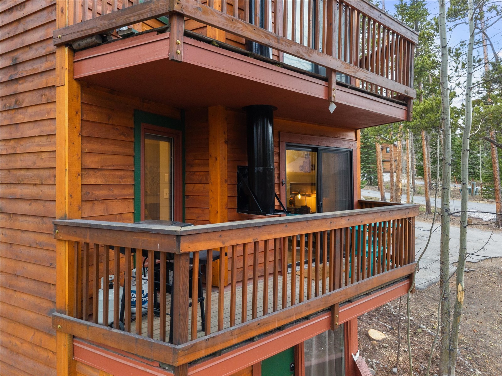 1140 Ski Hill Road, Unit 27 Breckenridge, CO 80424 - Photo 18 of 26 a view of a house with porch and wooden fence