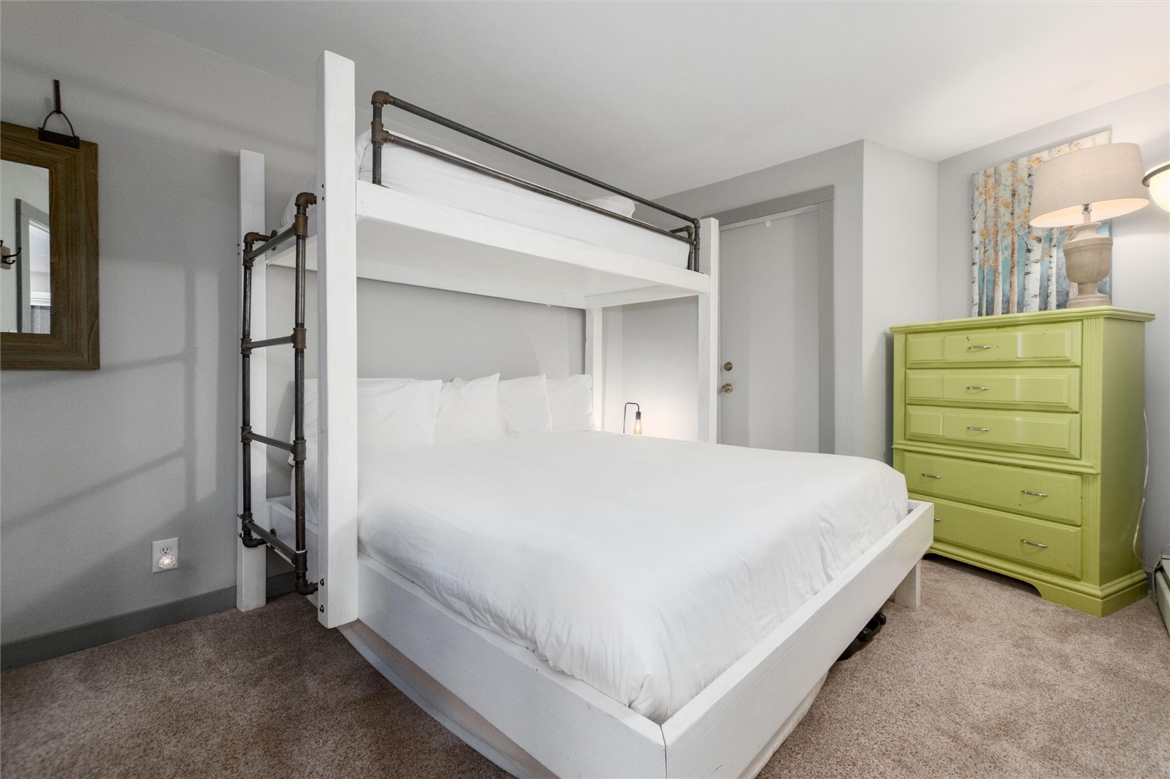 1140 Ski Hill Road, Unit 27 Breckenridge, CO 80424 - Photo 5 of 26 a large white bed in a white room