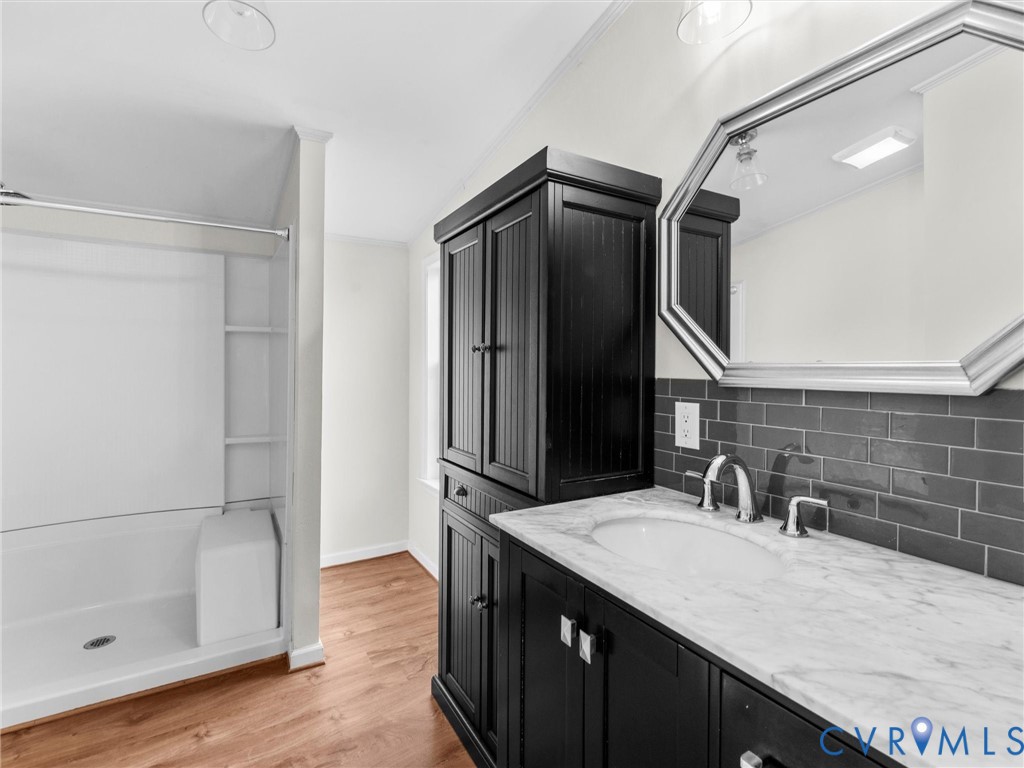 4772 Carsley Road Waverly, VA 23890 - Photo 18 of 38 Full bathroom with vanity, light wood-style floori