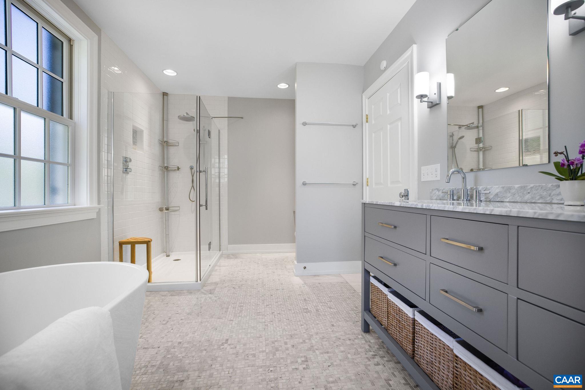 1504 Rugby Avenue Charlottesville, VA 22903 - Photo 21 of 51 a bathroom with a tub sink and mirror
