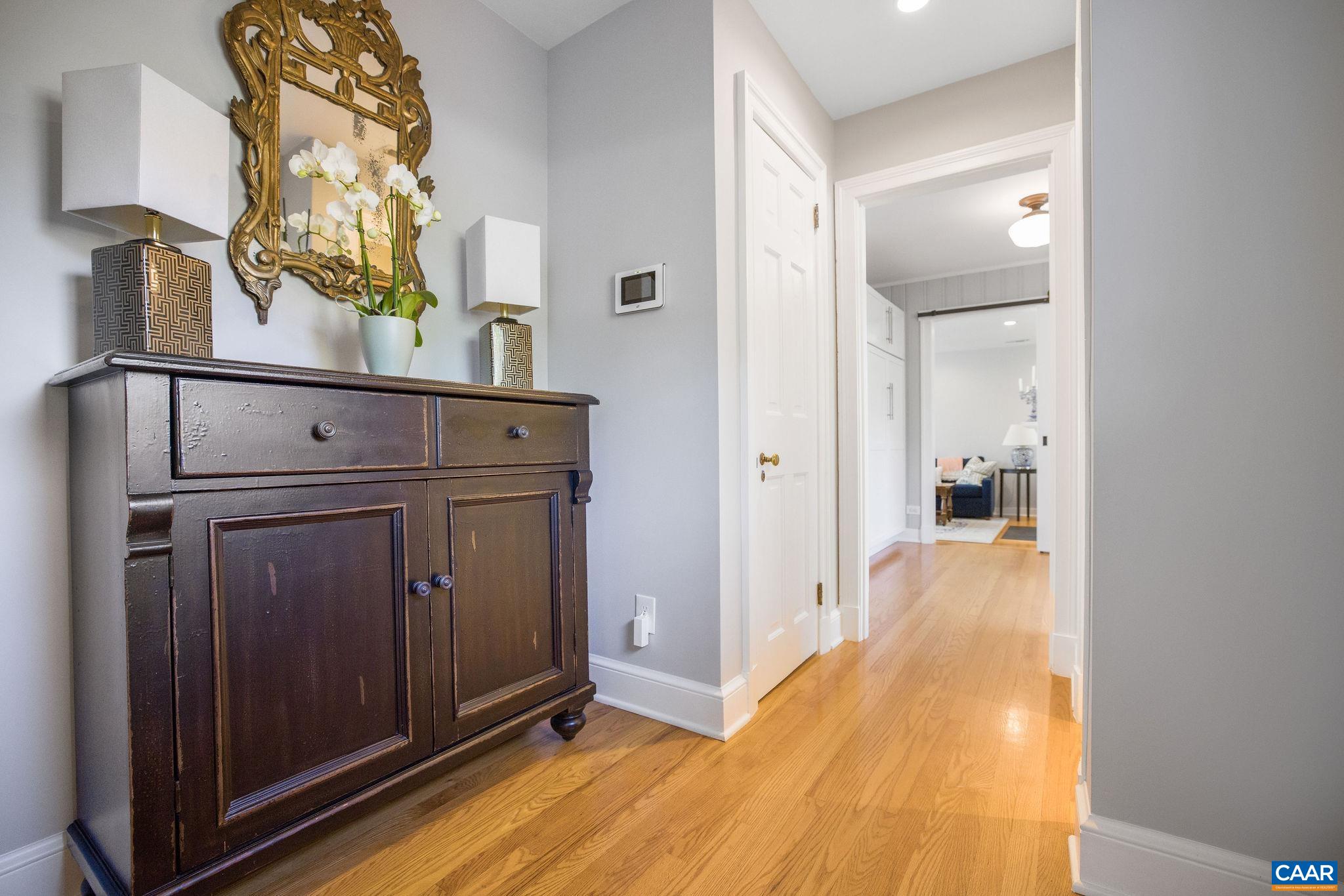 1504 Rugby Avenue Charlottesville, VA 22903 - Photo 4 of 51 a view of a hallway with wooden floor