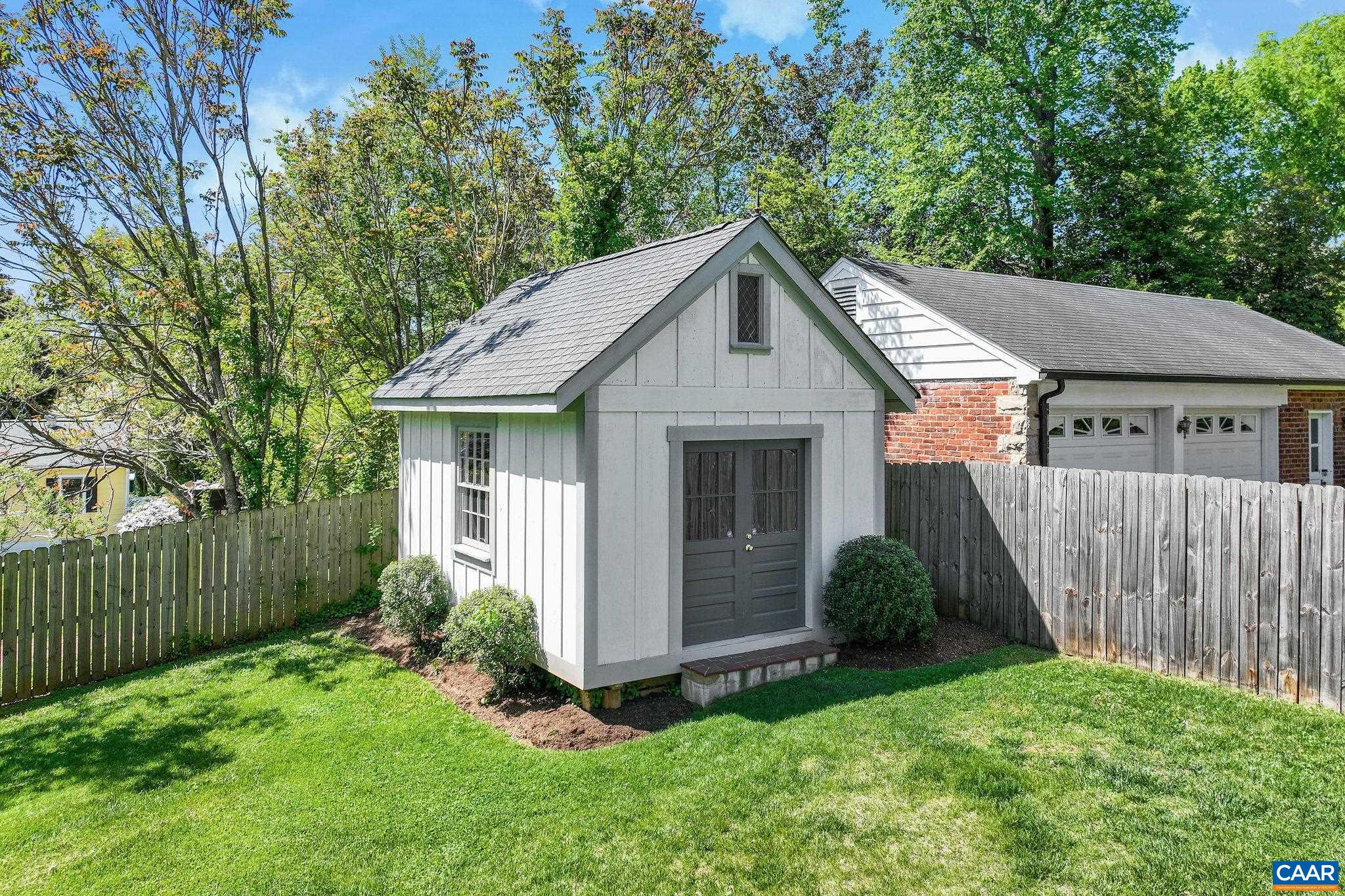 1504 Rugby Avenue Charlottesville, VA 22903 - Photo 45 of 51 a view of a house with a yard plants and large tree