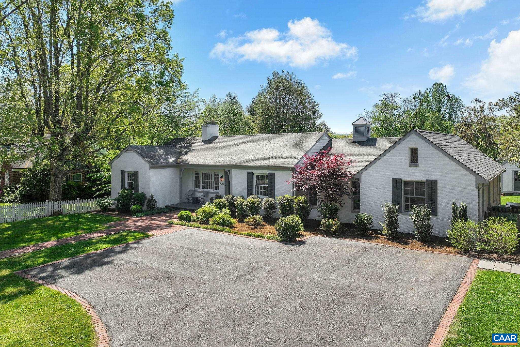 1504 Rugby Avenue Charlottesville, VA 22903 - Photo 50 of 51 a front view of a house with a yard and garage
