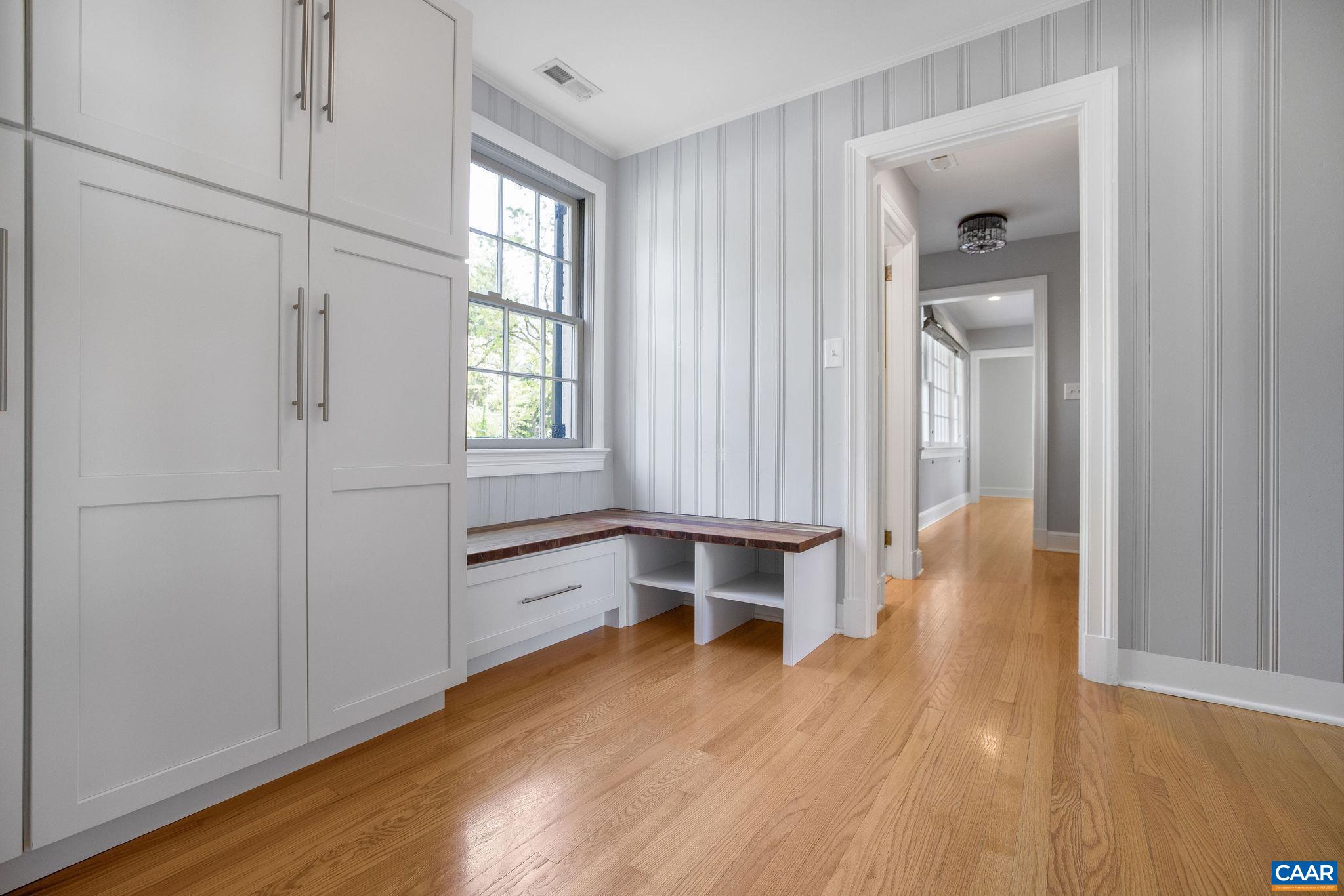 1504 Rugby Avenue Charlottesville, VA 22903 - Photo 5 of 51 an empty room with wooden floor and a window