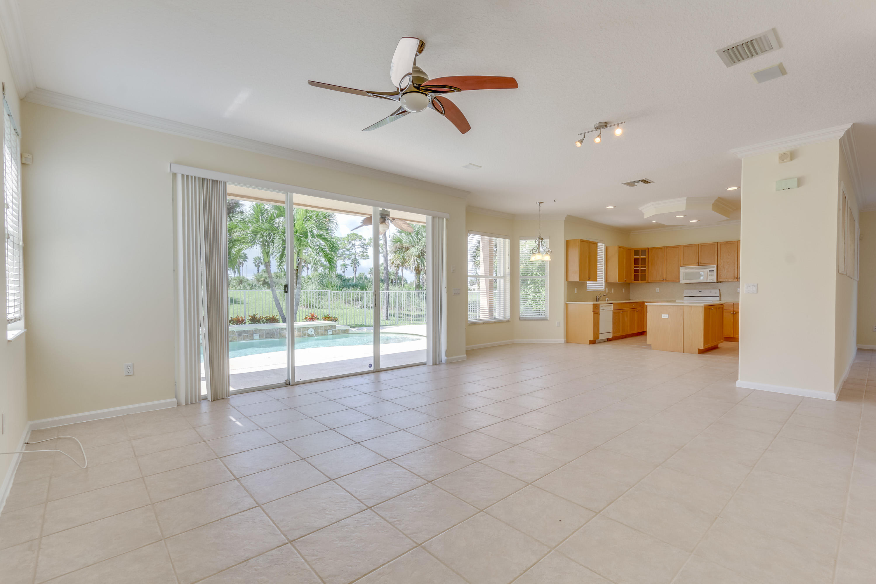 2121 Reston Circle Royal Palm Beach, FL 33411 - Photo 17 of 63 FAMILY ROOM/KITCHEN/POOL AREA