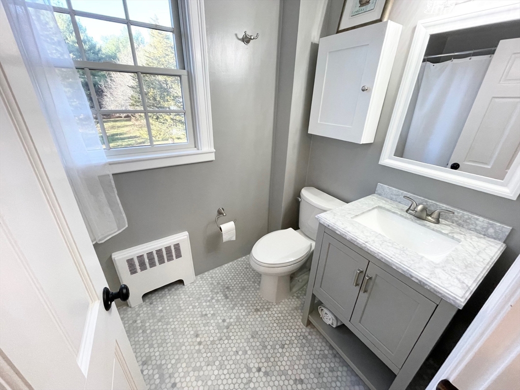 71 Morse Street Sharon, MA 02067 - Photo 25 of 40 a bathroom with a sink toilet and window