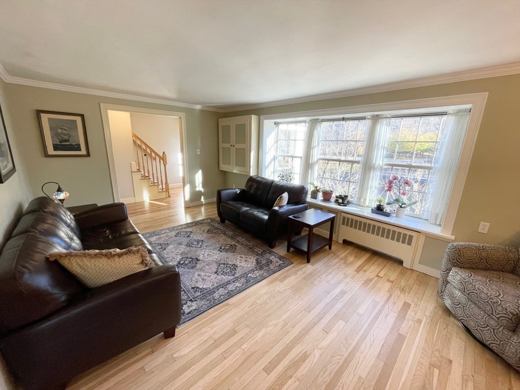 71 Morse Street Sharon, MA 02067 - Photo 10 of 40 a living room with furniture and a large window