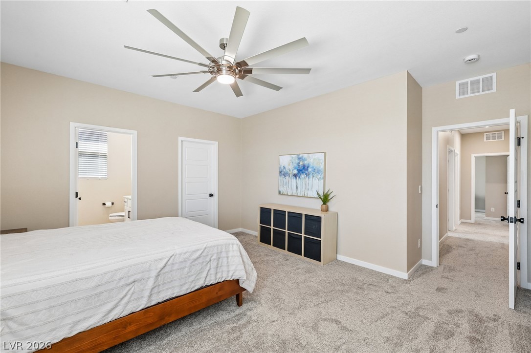 194 Viento Ridge Street Henderson, NV 89012 - Photo 47 of 72 Soft carpeting pairs with neutral walls to create a restful, comfortable main suite atmosphere.