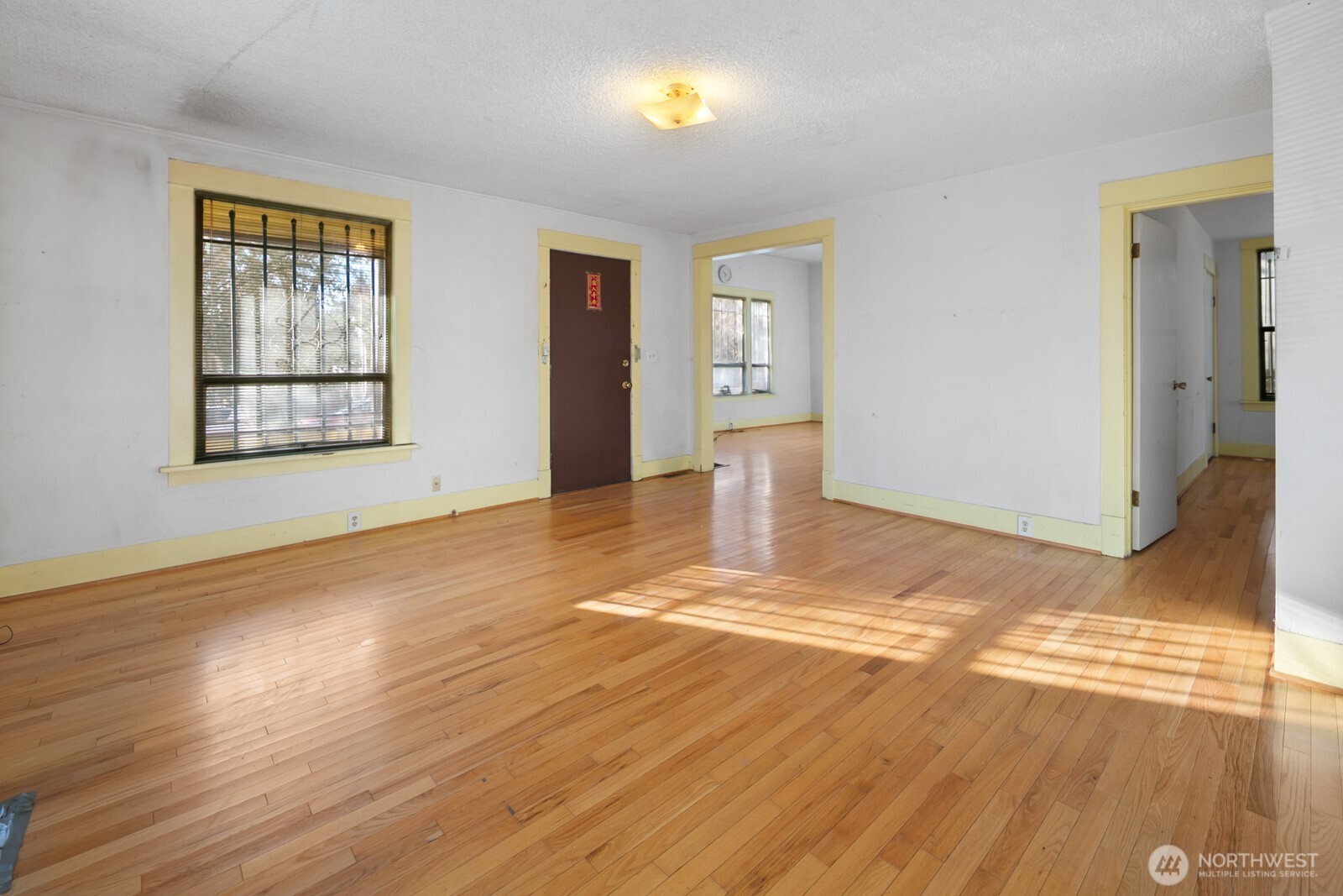 3226 South Edmunds Street Seattle, WA 98118 - Photo 6 of 35 a view of empty room with wooden floor and fan