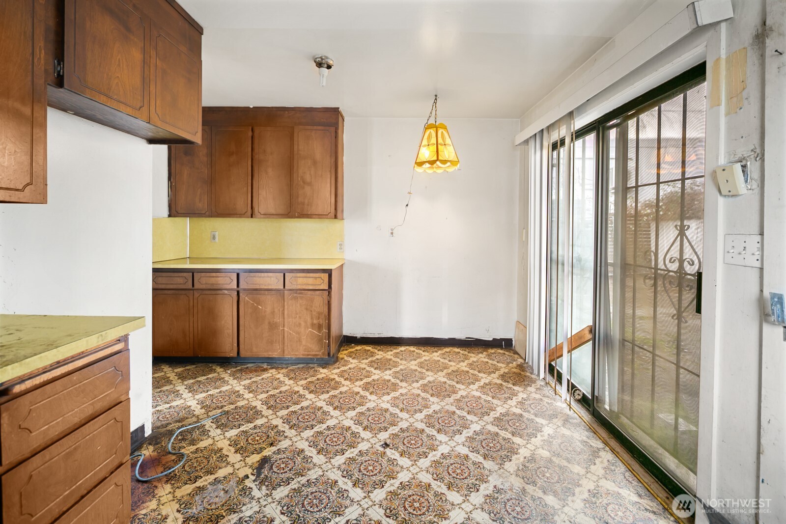 3226 South Edmunds Street Seattle, WA 98118 - Photo 9 of 35 a view of a kitchen with wooden floor and a window