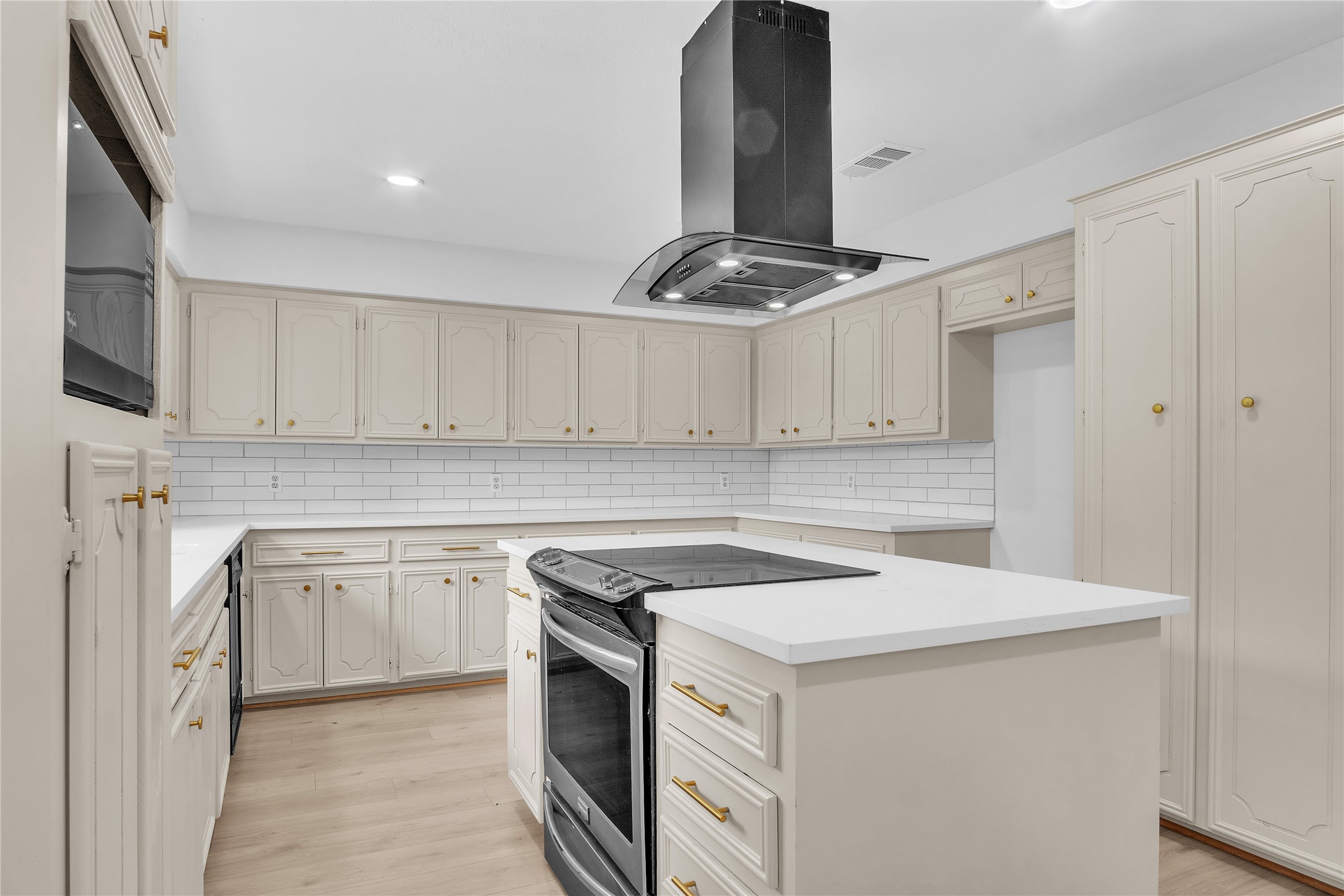 108 Woodland Road Lake Jackson, TX 77566 - Photo 14 of 50 a kitchen with granite countertop a sink stainless steel appliances and white cabinets