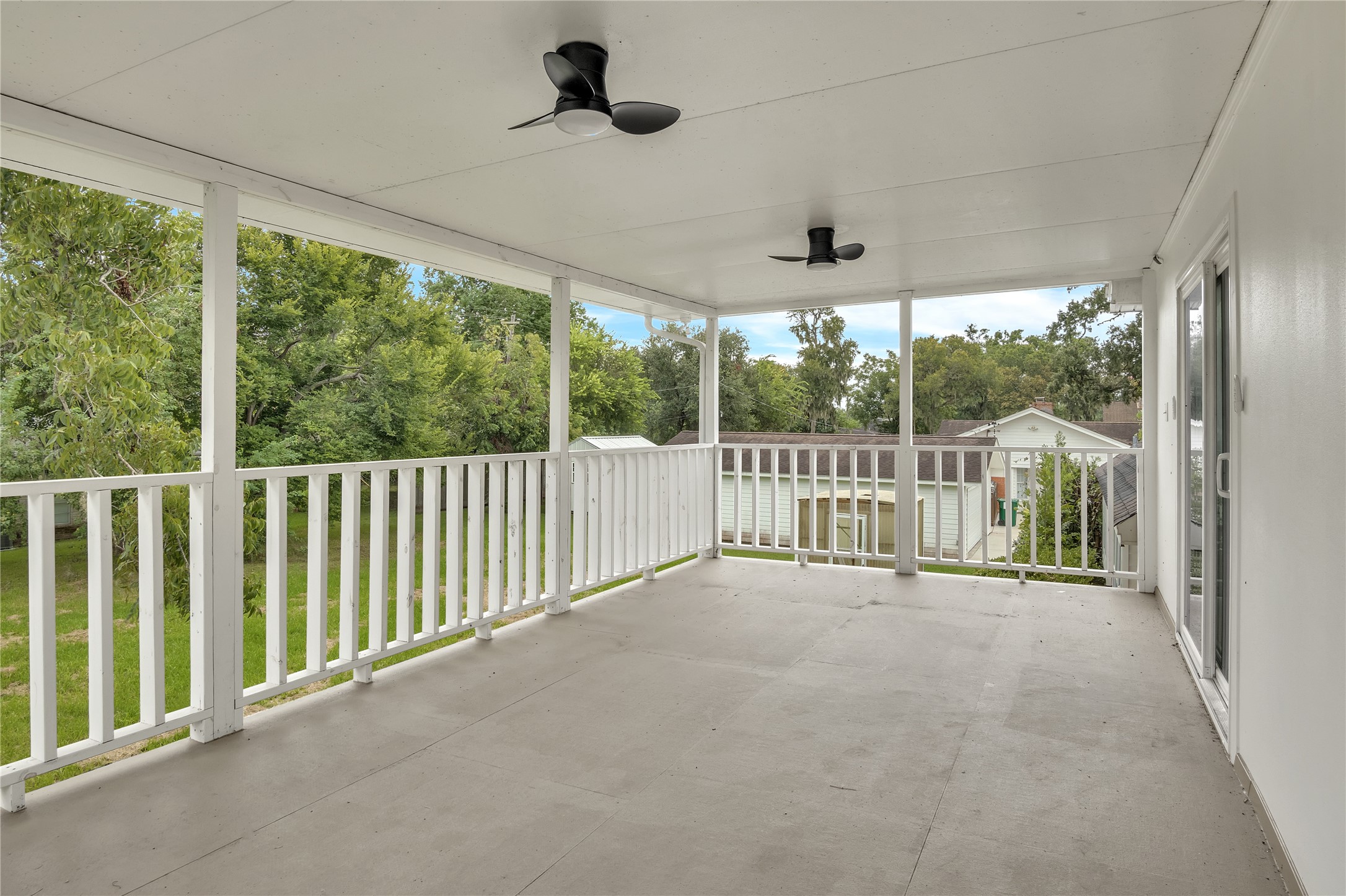 108 Woodland Road Lake Jackson, TX 77566 - Photo 26 of 50 a view of a porch with a floor to ceiling window