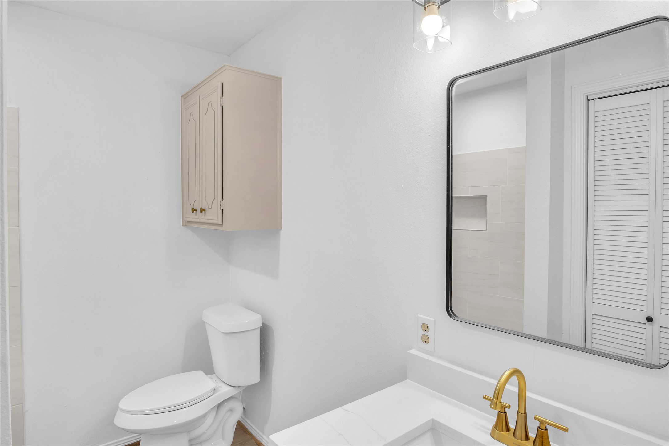 108 Woodland Road Lake Jackson, TX 77566 - Photo 35 of 50 a white toilet sitting next to a bathroom sink