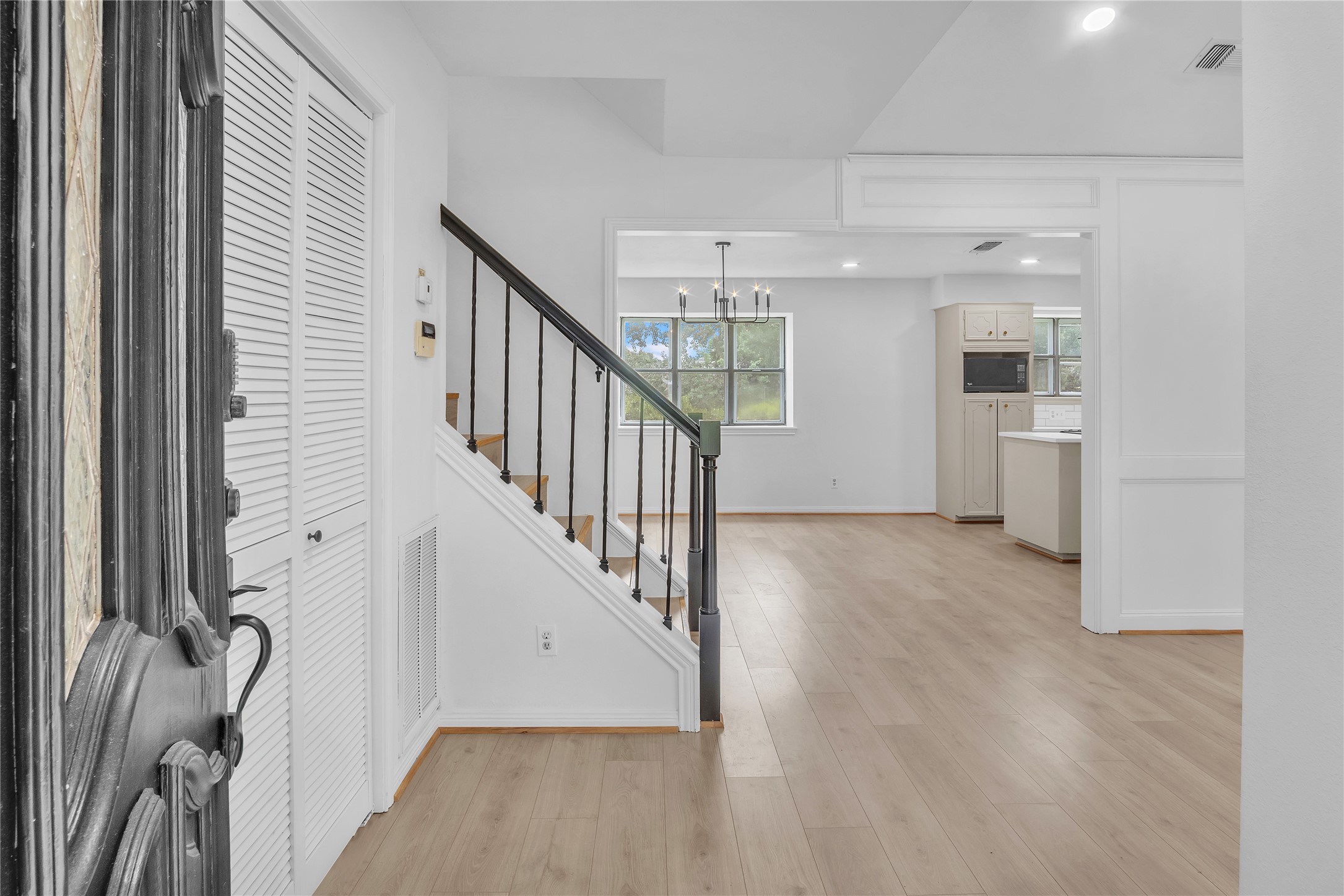 108 Woodland Road Lake Jackson, TX 77566 - Photo 7 of 50 a view of hallway with stairs and wooden floor