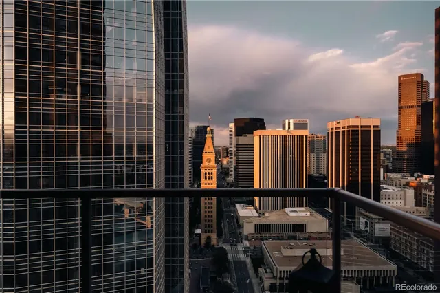 a living room with furniture and large windows