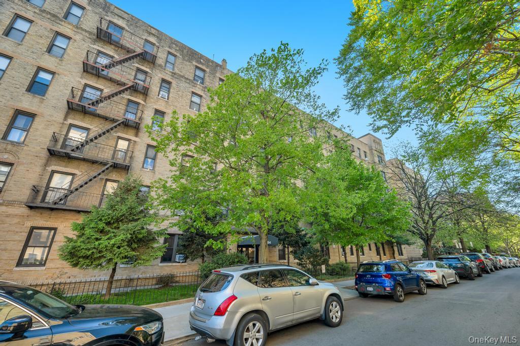 83-64 Talbot Street, Unit 3A Queens, NY 11415 - Photo 14 of 15 Multi-story building featuring a brick exterior and numerous windows