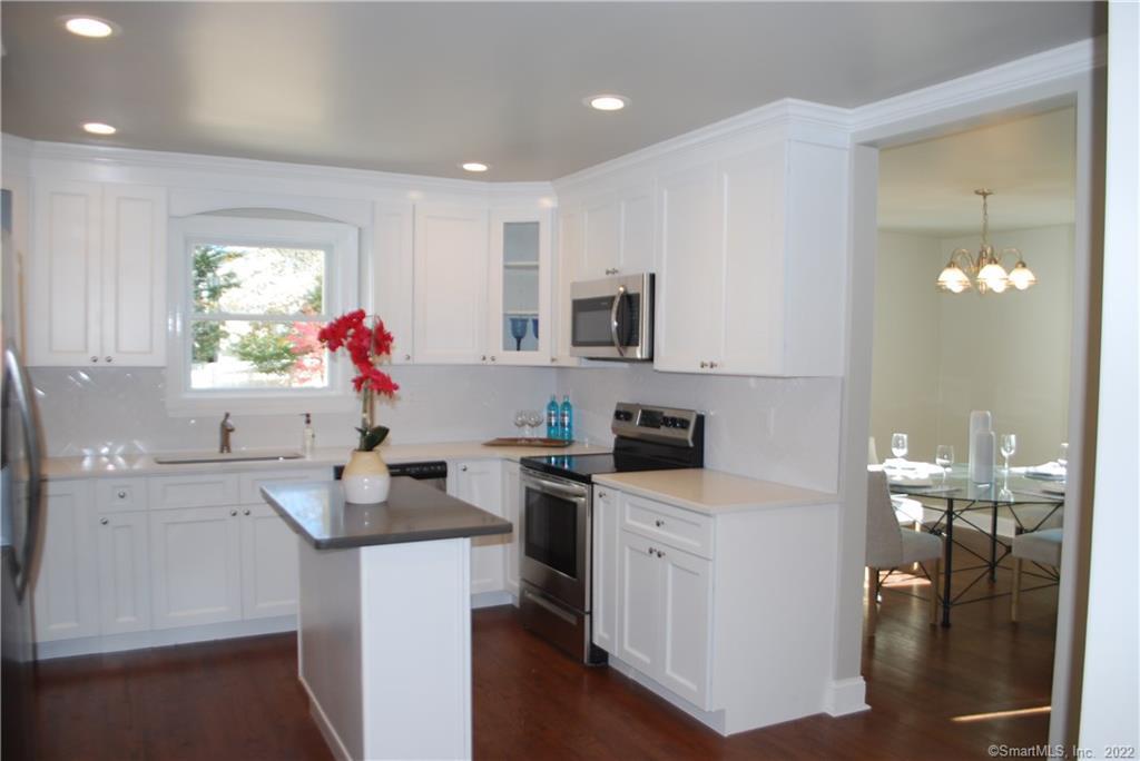 23 Old Road Westport, CT 06880 - Photo 1 of 1 a kitchen with a sink cabinets and wooden floor