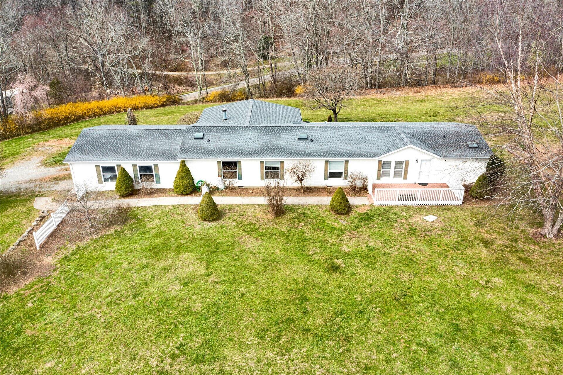 2121 Cannady School Road Southeast Floyd, VA 24091 - Photo 2 of 41 a view of a swimming pool with a yard and sitting area