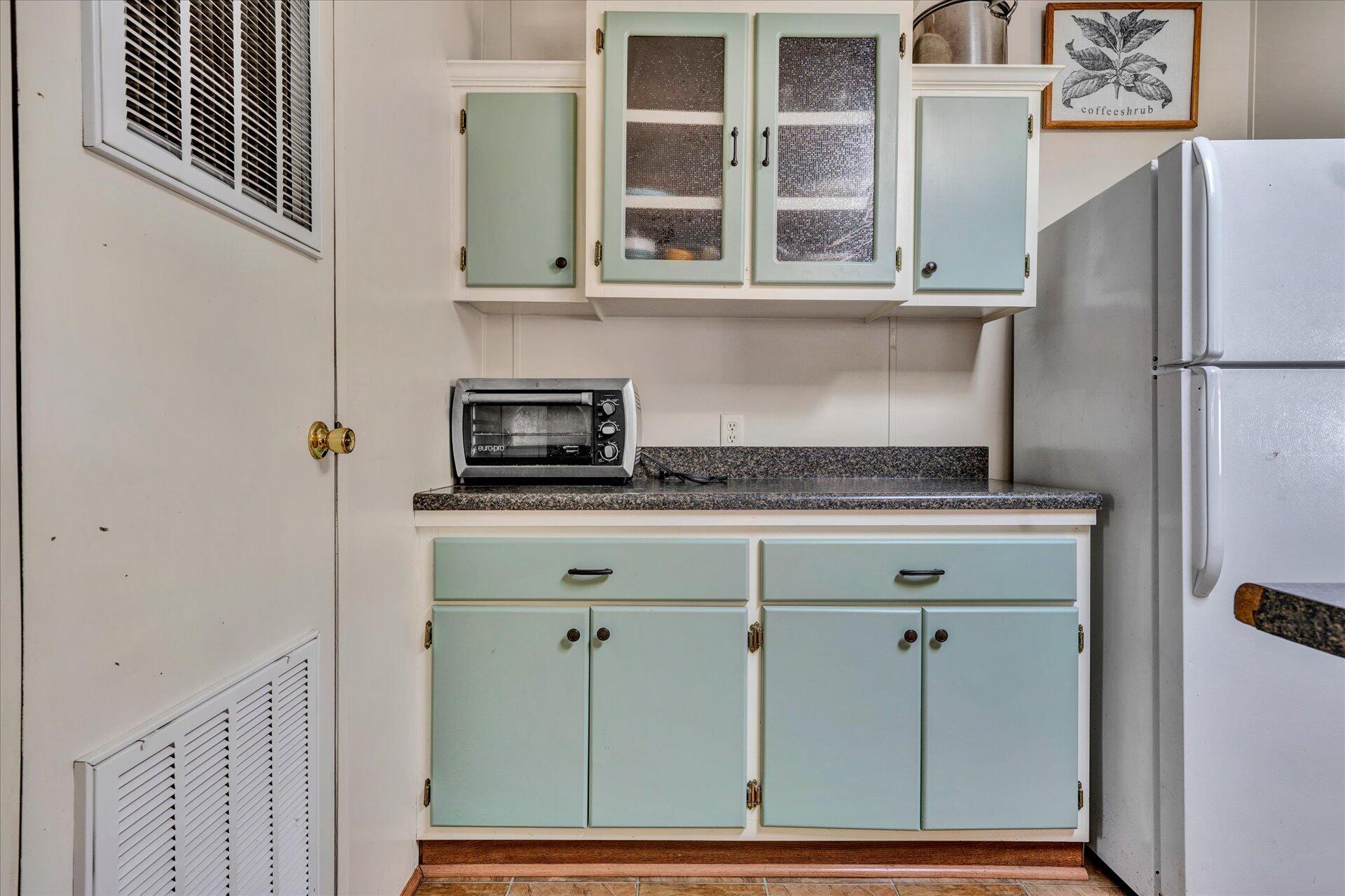 2121 Cannady School Road Southeast Floyd, VA 24091 - Photo 24 of 41 a kitchen with a refrigerator and cabinets