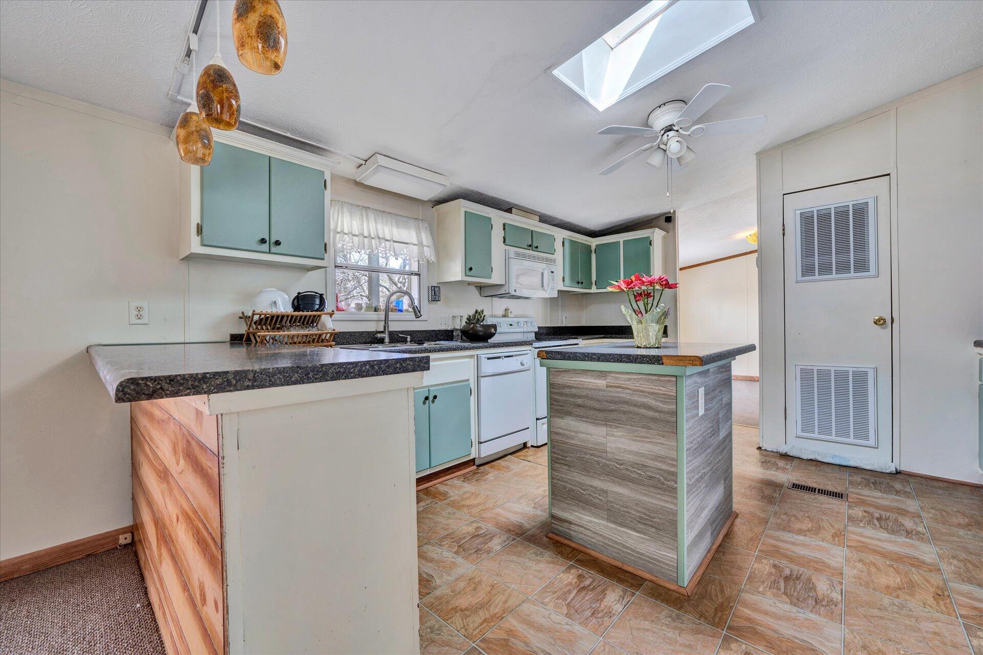 2121 Cannady School Road Southeast Floyd, VA 24091 - Photo 25 of 41 a kitchen with kitchen island granite countertop a sink cabinets and stainless steel appliances