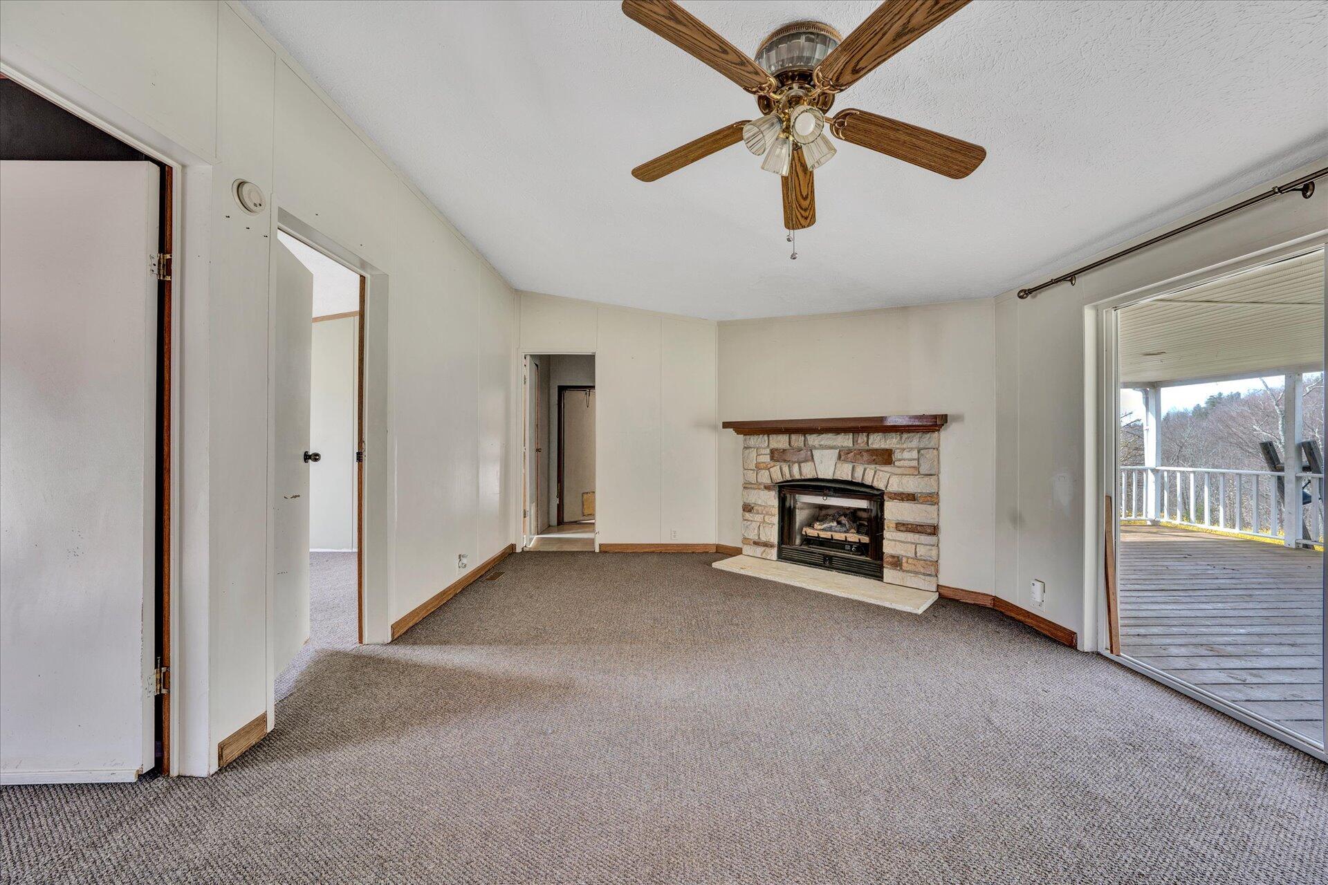 2121 Cannady School Road Southeast Floyd, VA 24091 - Photo 27 of 41 an empty room with windows and fireplace