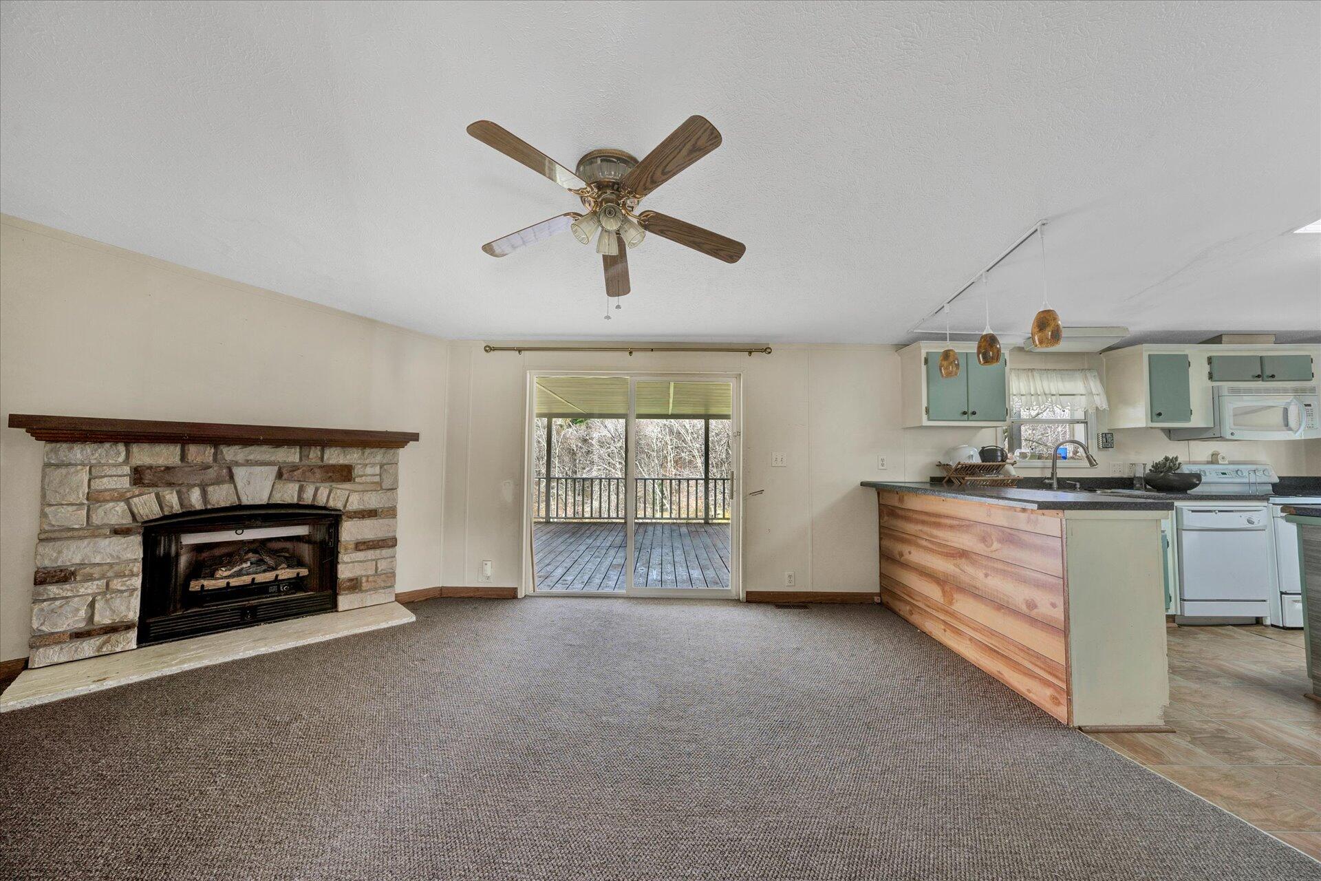 2121 Cannady School Road Southeast Floyd, VA 24091 - Photo 29 of 41 a living room with furniture and a fireplace