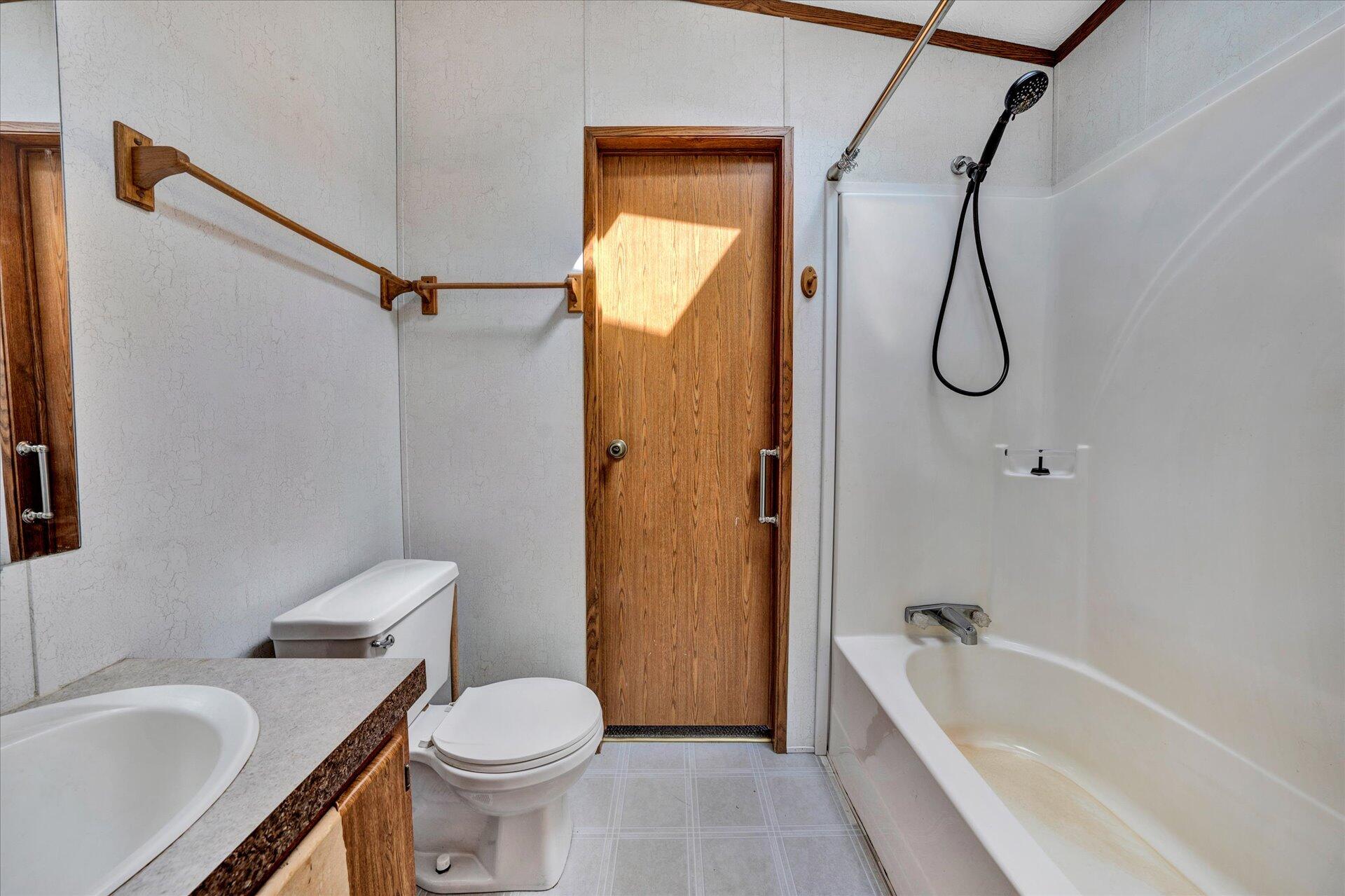2121 Cannady School Road Southeast Floyd, VA 24091 - Photo 33 of 41 a bathroom with a granite countertop toilet sink and shower
