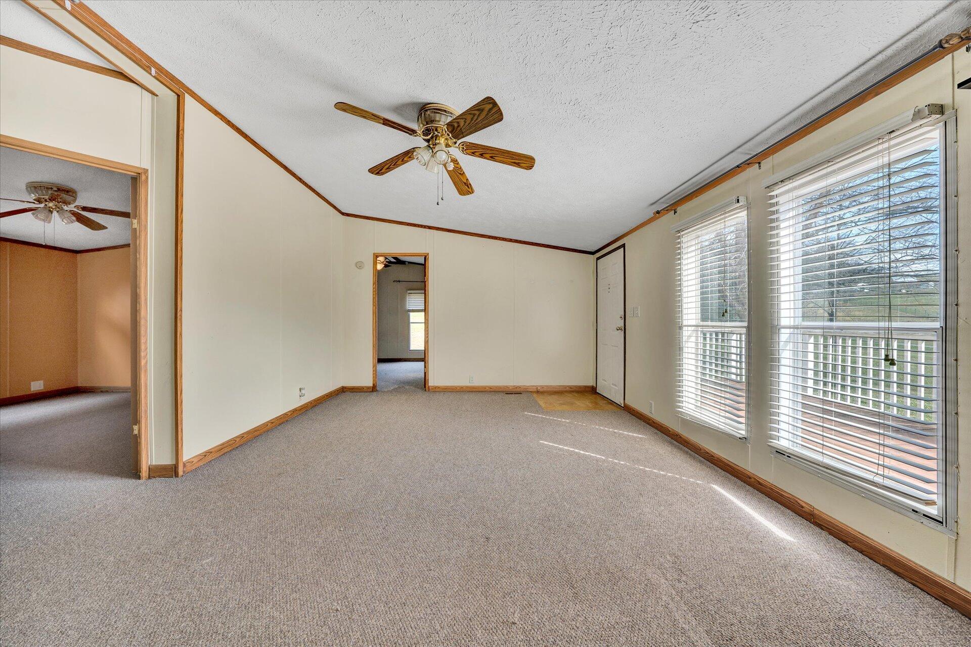 2121 Cannady School Road Southeast Floyd, VA 24091 - Photo 7 of 41 a view of a livingroom with wooden floor and white walls