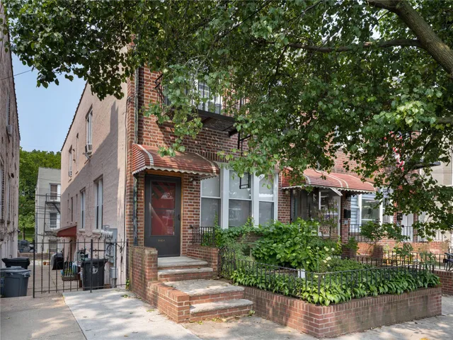 a front view of a house with yard
