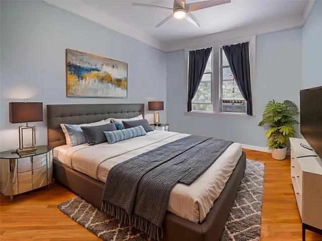 a bedroom with bed and a window