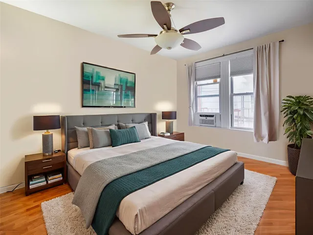 a bedroom with bed and a window