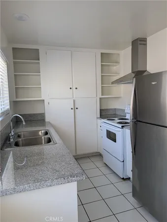 a kitchen with appliances cabinets and a sink