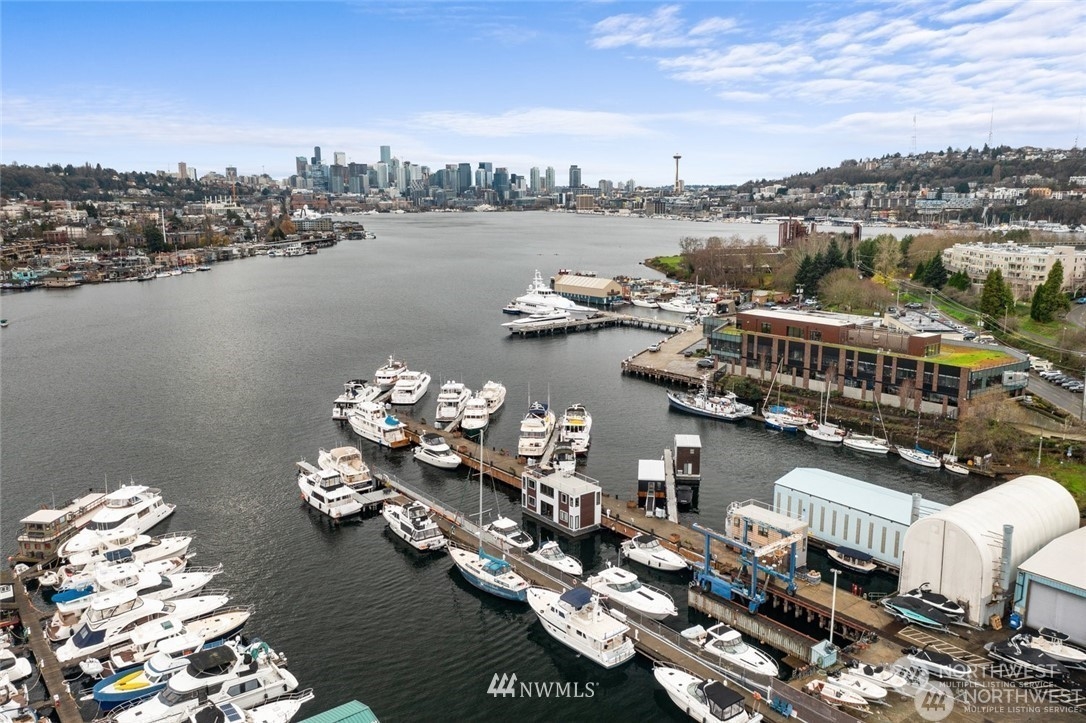 2309 North Northlake Way, Unit 3A Seattle, WA 98103 - Photo 4 of 4 a view of a lake with lawn chairs