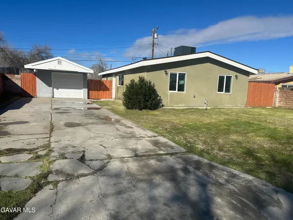 a front view of a house with yard