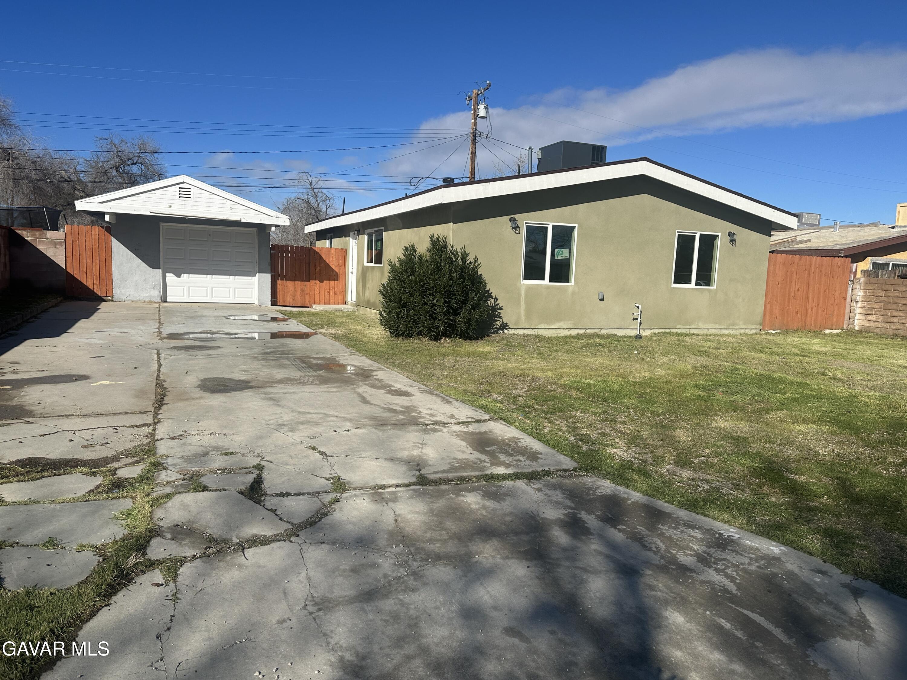 44655 4th Street East Lancaster, CA 93535 - Photo 2 of 4 a front view of a house with yard